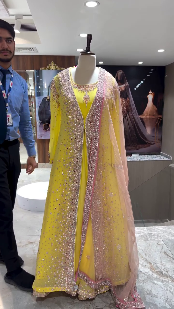 Designer Yellow Floor-Length Anarkali Gown with Heavy Stone and Sequin Embellished Net Overlay, Matching Dupatta, and Intricate Border Work – Perfect for Weddings, Receptions, and Festive Occasions