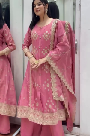 Buy new Pink Silk Anarkali Suit Featuring Intricate Zari Embroidery, Button Detailing, and Scalloped Lace Dupatta – Perfect for Weddings, Festive Celebrations, and Ethnic Gatherings