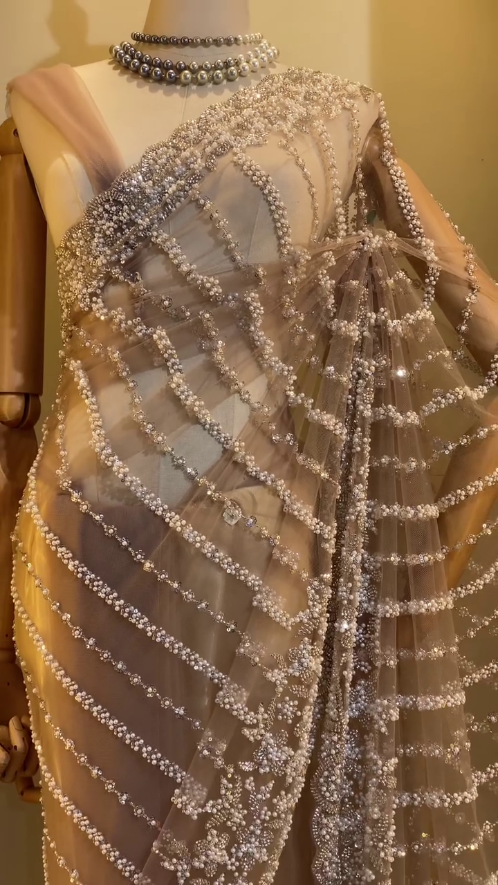 Luxurious Designer Net Saree in Nude Beige Shade with All-Over Hand Embellished Sequins, Pearls, and Beadwork in Wavy Pattern, Paired with Matching Blouse – Ideal for Glamorous Evening Parties, Receptions, and Modern Bridal Looks - Image 2