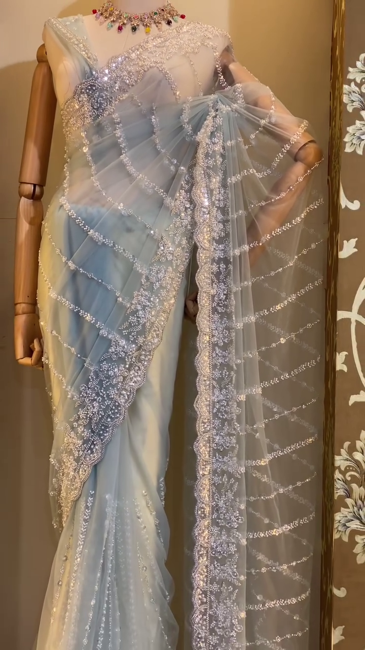 Graceful Ice Blue Designer Net Saree with All-Over Sequin, Pearl, and Bead Embroidery in Curved Stripe Pattern, Featuring Heavily Embellished Border and Matching Blouse – Ideal for Engagements, Cocktail Parties, and Modern Wedding Celebrations - Image 2